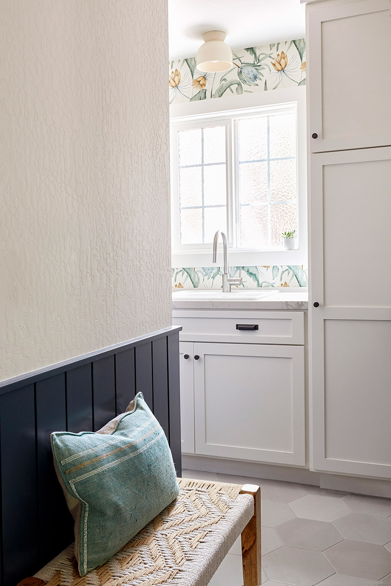 wainscoting flat panels in navy blue and botanical wallpaper