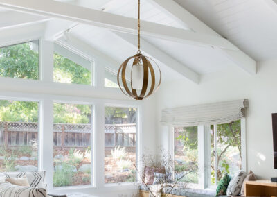 bright living room with lots of windows and high ceilings