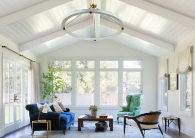 sitting room with wall of windows and high ceilings