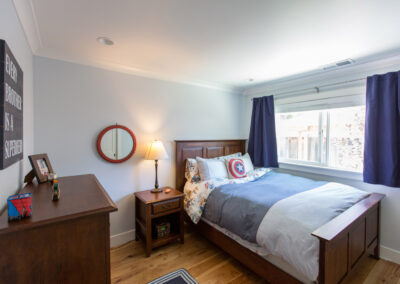 boys bedroom with warm wood floors