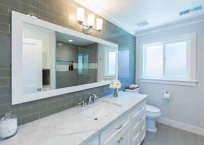 large vanity and mirror in bright bathroom