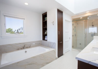 modern bathroom with tub shower sink and built in storage