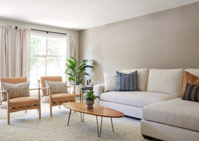 living room with expansive windows and warm neutral tones