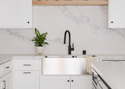 stainless steel farmhouse sink in modern kitchen