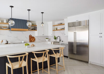 modern kitchen with warm wood accents and white cabinets pops of blue