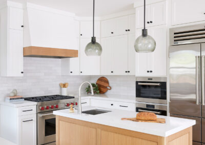 kitchen cabinets and island with modern pendant lights