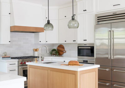 kitchen with white cabinets and warm wood accents