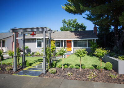 gray custom pergola matching the gray exterior of the house