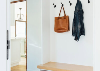 entryway bench and hooks with mediterranean style tile floor