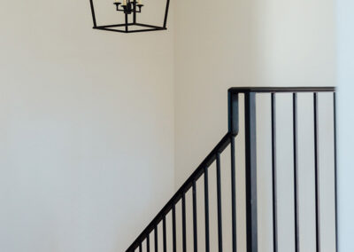 iron staircase railing and modern iron cage chandelier
